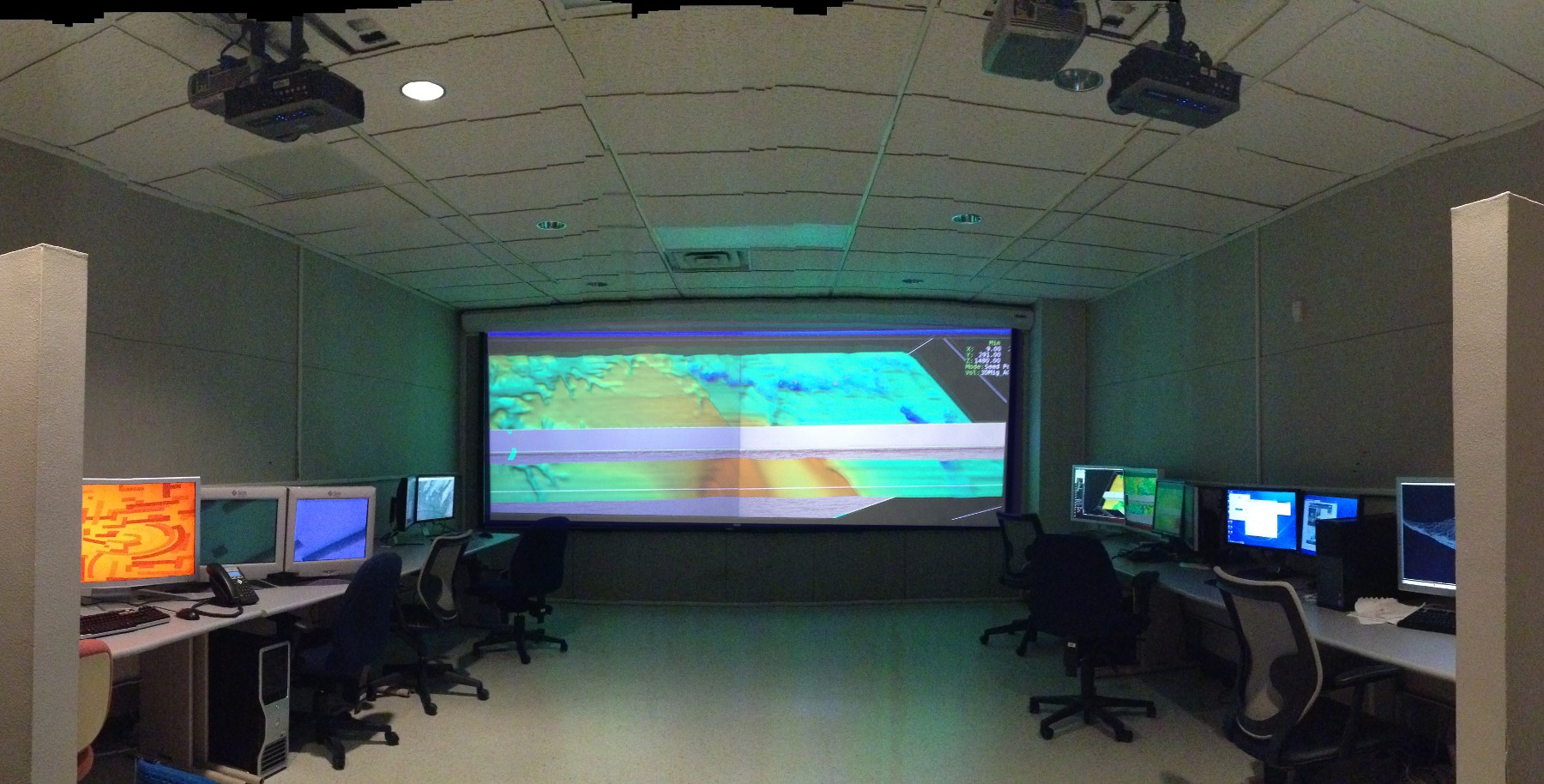 STARR Visualiztion Lab with four projectors on double wide screen and workstations.