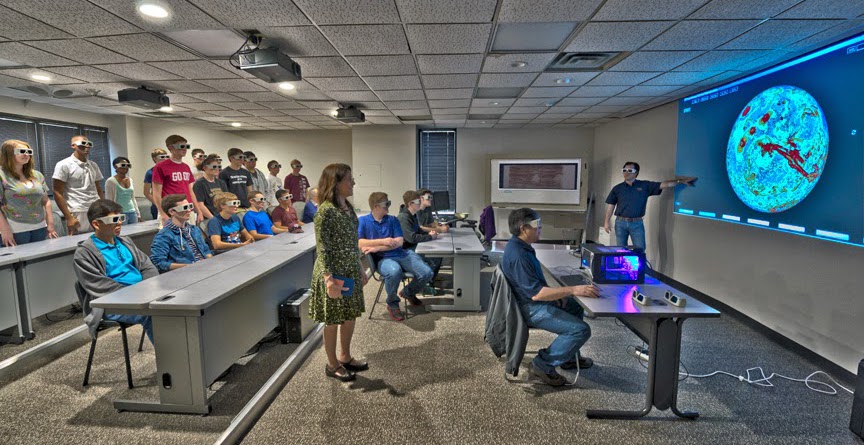 Auditorium with students wearing 3D glasses viewing Mars geology.
